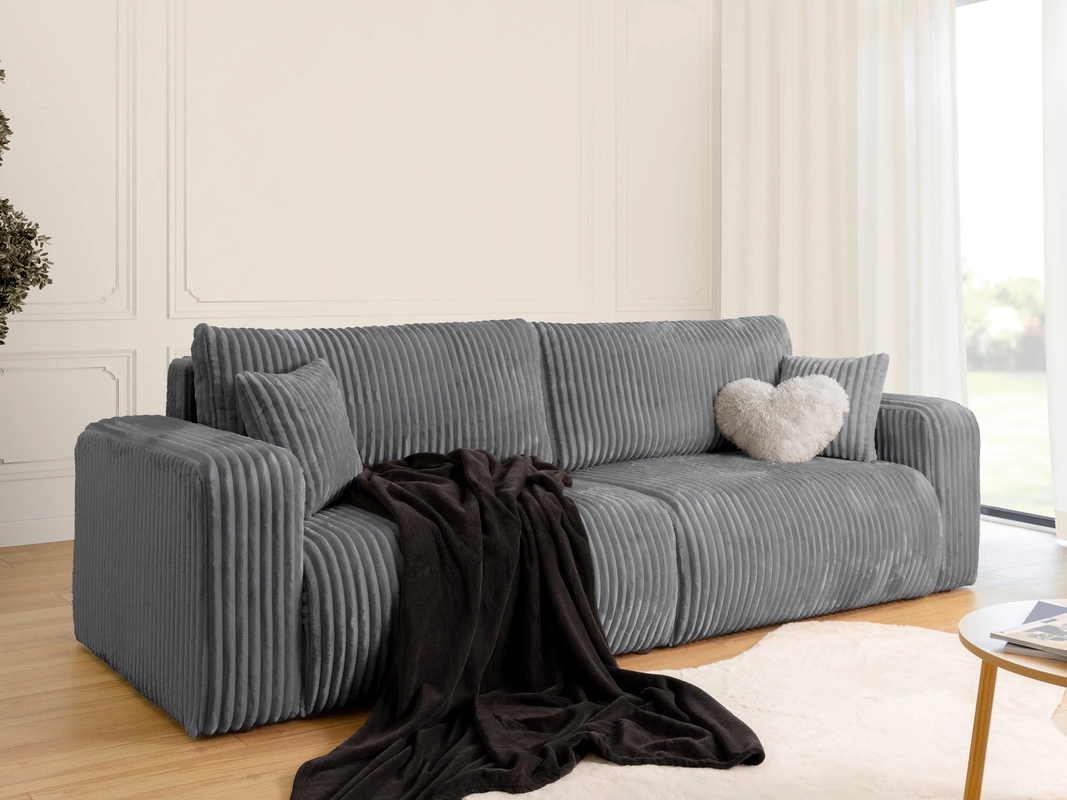 Jak ułożyć koc na kanapie? Proste sposoby na modny i przytulny salon